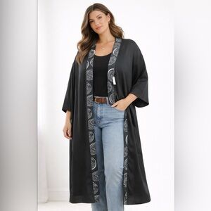 Elegant Black Cape with Patterned Trim